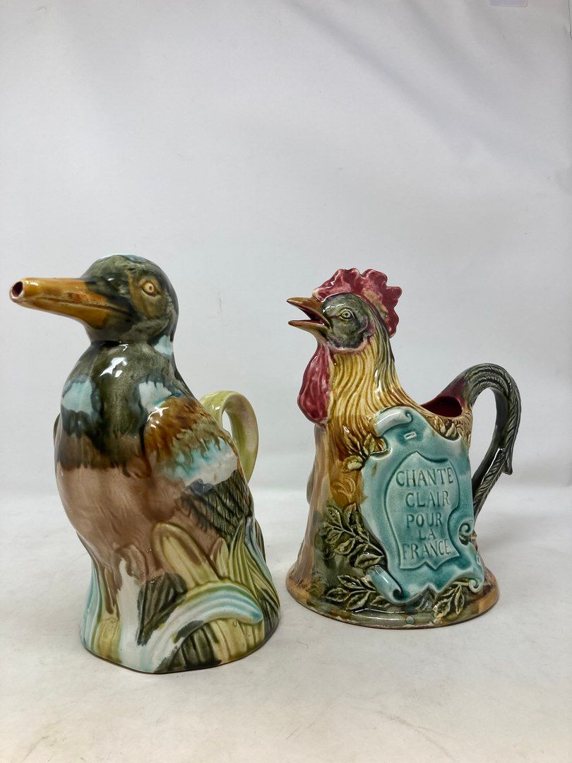 Null Onnaing 

Lot of two pitchers representing a duck and a rooster.

H. 22 and&hellip;