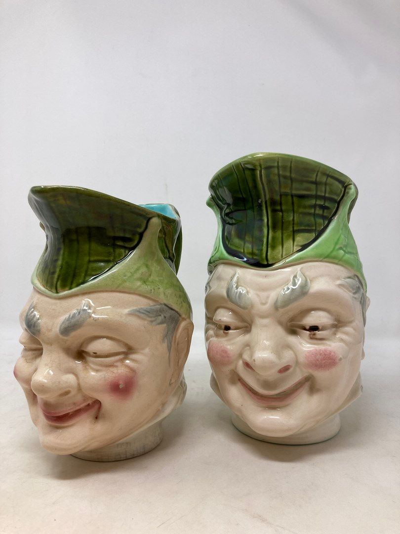 Null Sarreguemines 

Two Joker jugs. 

Chips on each 

H. 21 and 18 cm