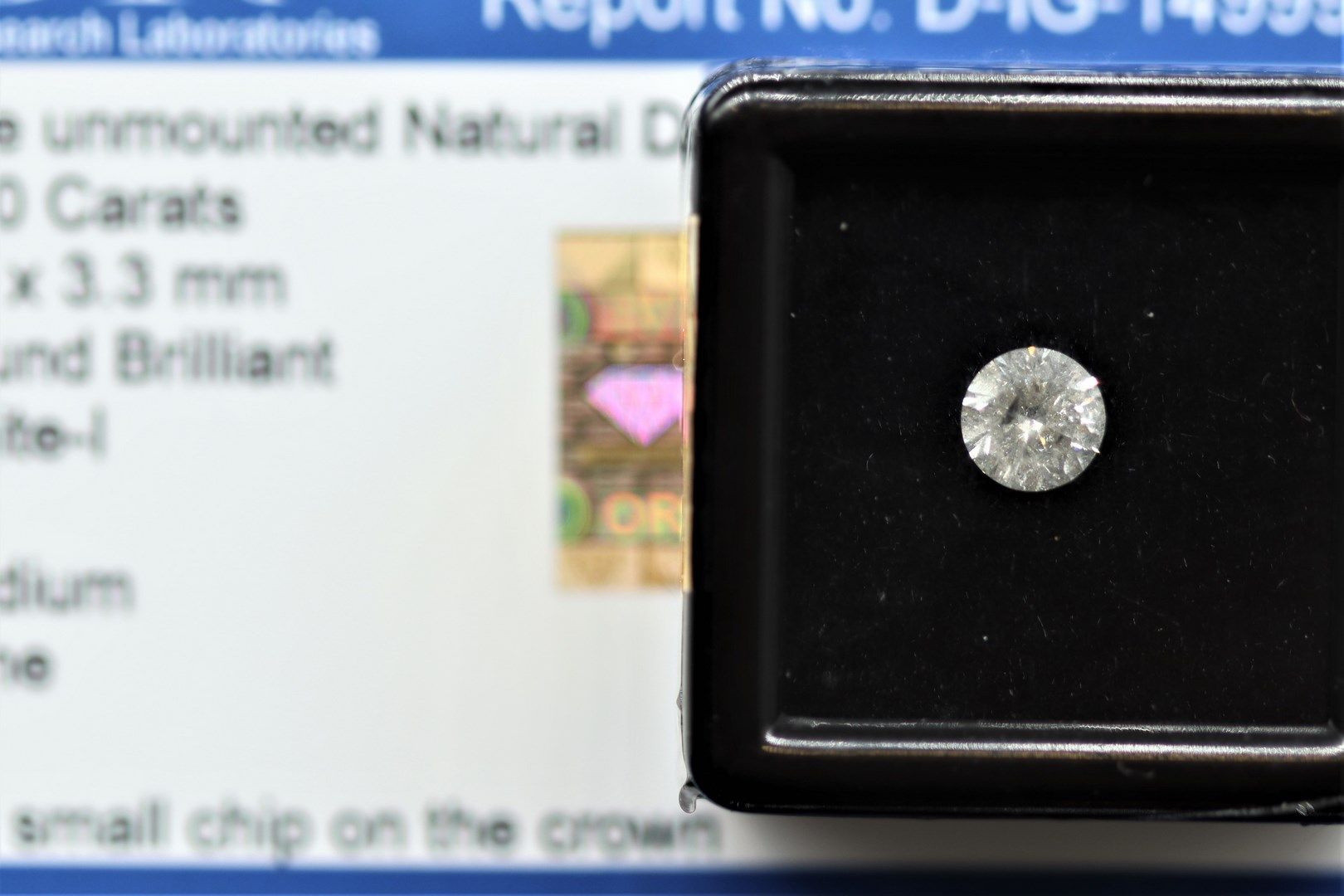 Null White I" round diamond under seal. 

Accompanied by a report of the IGR att&hellip;