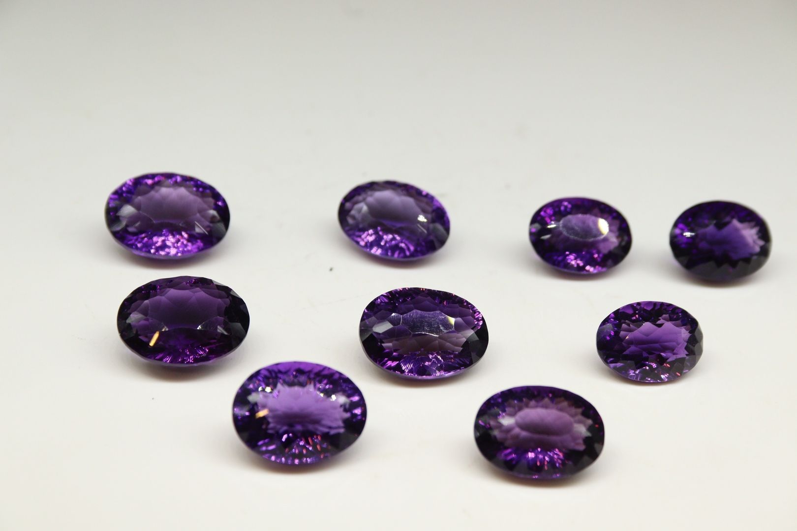 Null Lot of amethyst on paper. 

Weight : 409.85 cts.