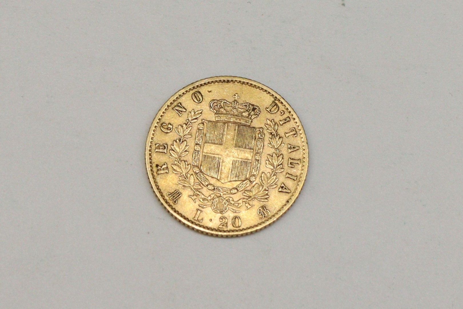 Null Gold coin of 20 Lira Vittorio Emanuele II, 1873.

Weight : 6.45g.