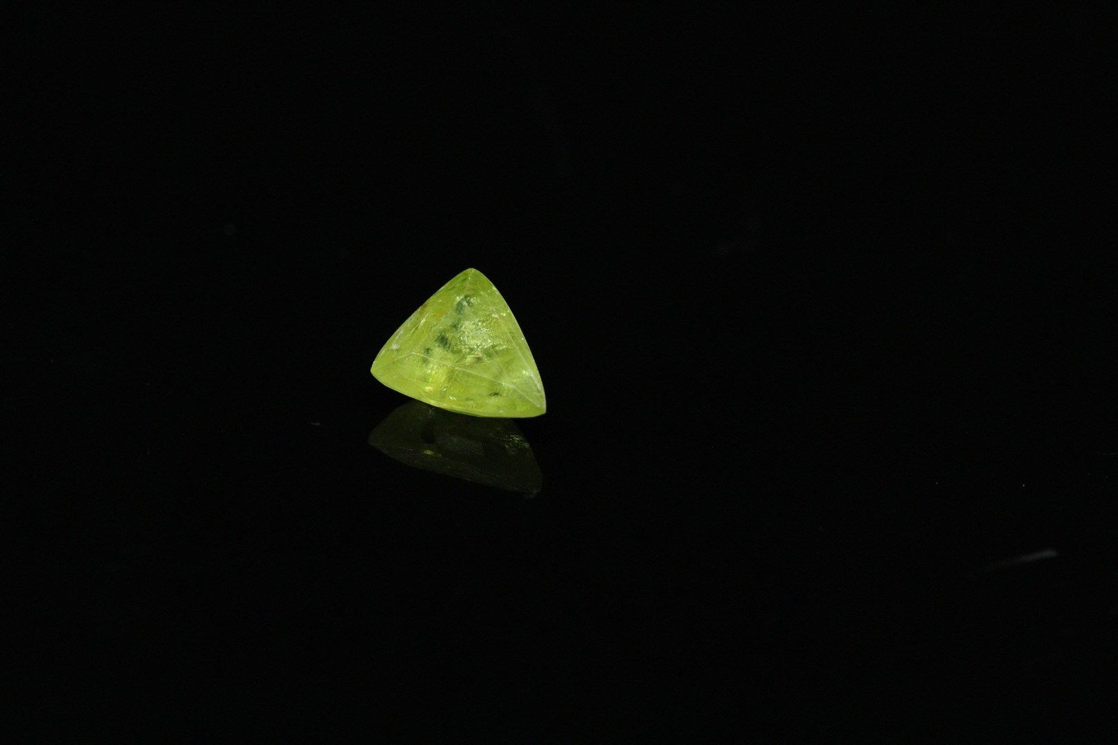 Null Sphene trillion on paper. 

Weight : 5.79 cts.