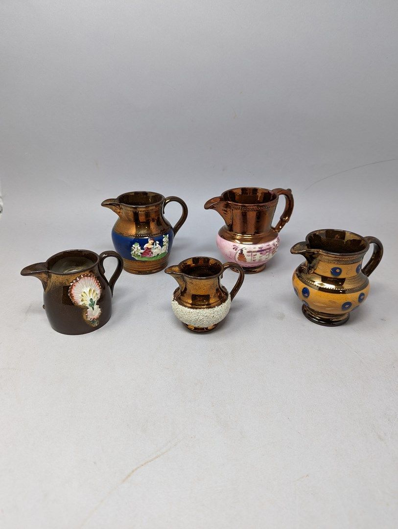 Null JERSEY
Collection of earthenware pitchers and jugs with different types of &hellip;