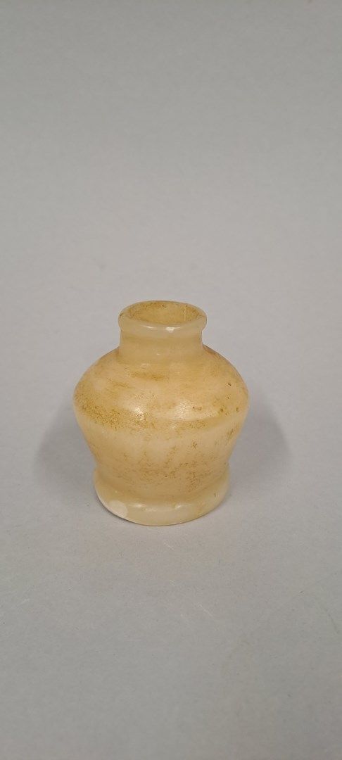 Null Small cosmetic vase with globular body and discoid foot.
Alabaster, neck cu&hellip;