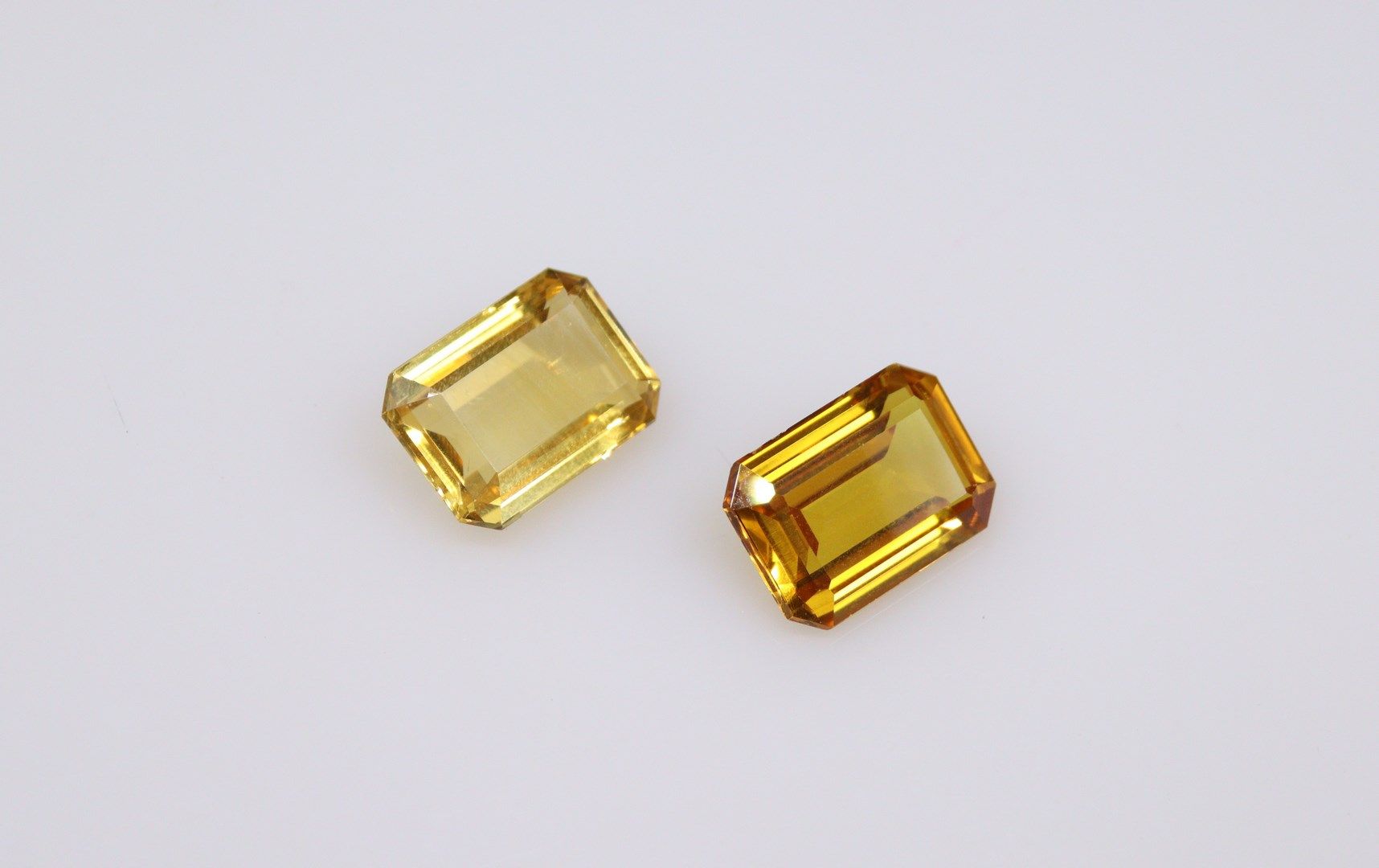 Null Lot of two stones on paper including a rectangular citrine with cut sides a&hellip;