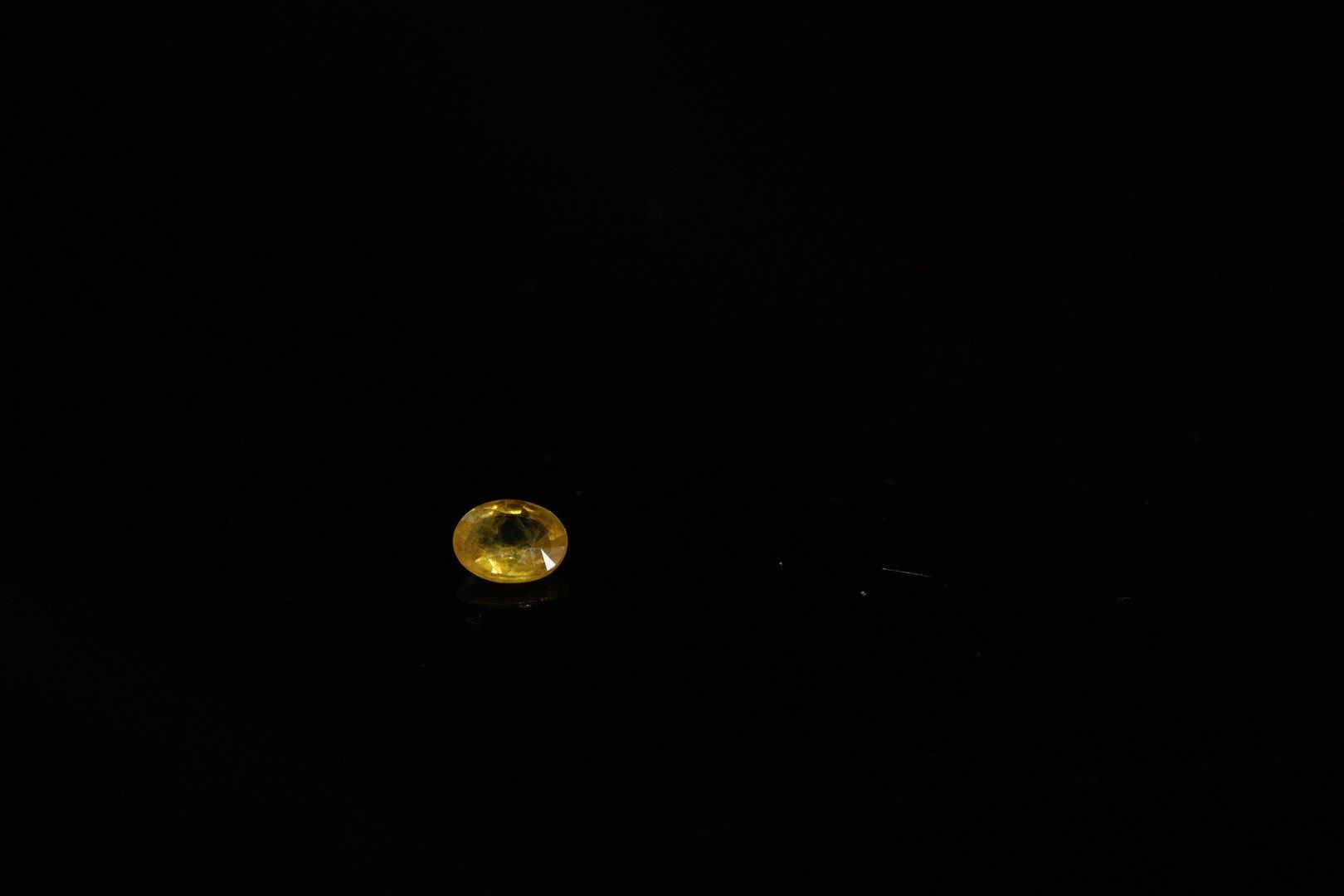 Null Oval yellow sapphire on paper. 
Weight : 0.60 ct.