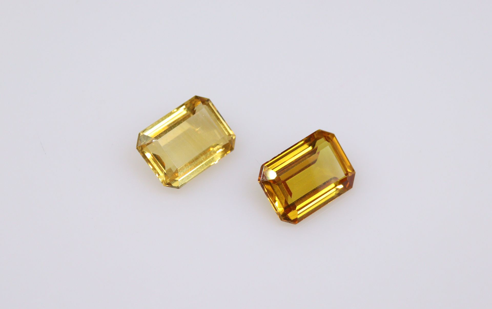 Null Lot of two stones on paper including a rectangular citrine with cut sides a&hellip;