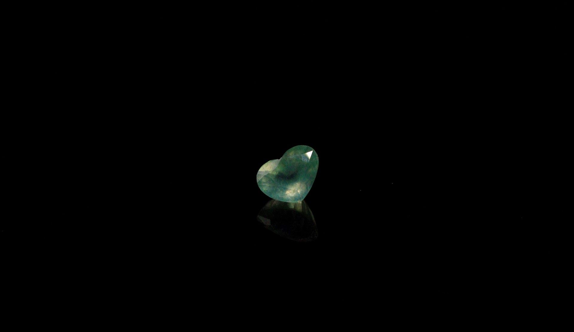 Null Prehnite heart on paper. 
Weight : 2.23 cts. 

Dimensions : 8.8mm x 7.2mm