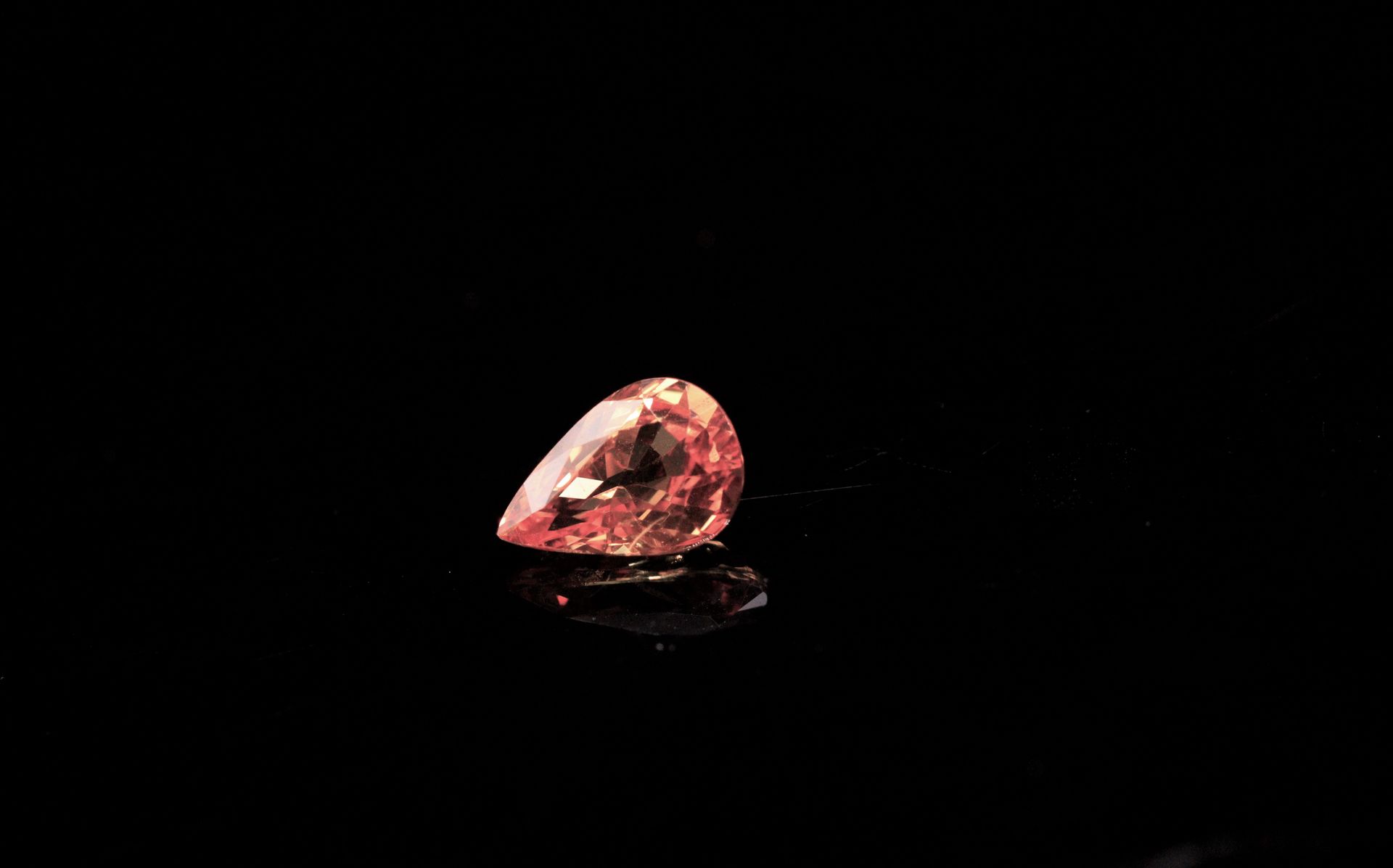 Null Padparadscha pear sapphire on paper. 
VS. 
Weight: 1.45 ct. 

Dimensions: 8&hellip;