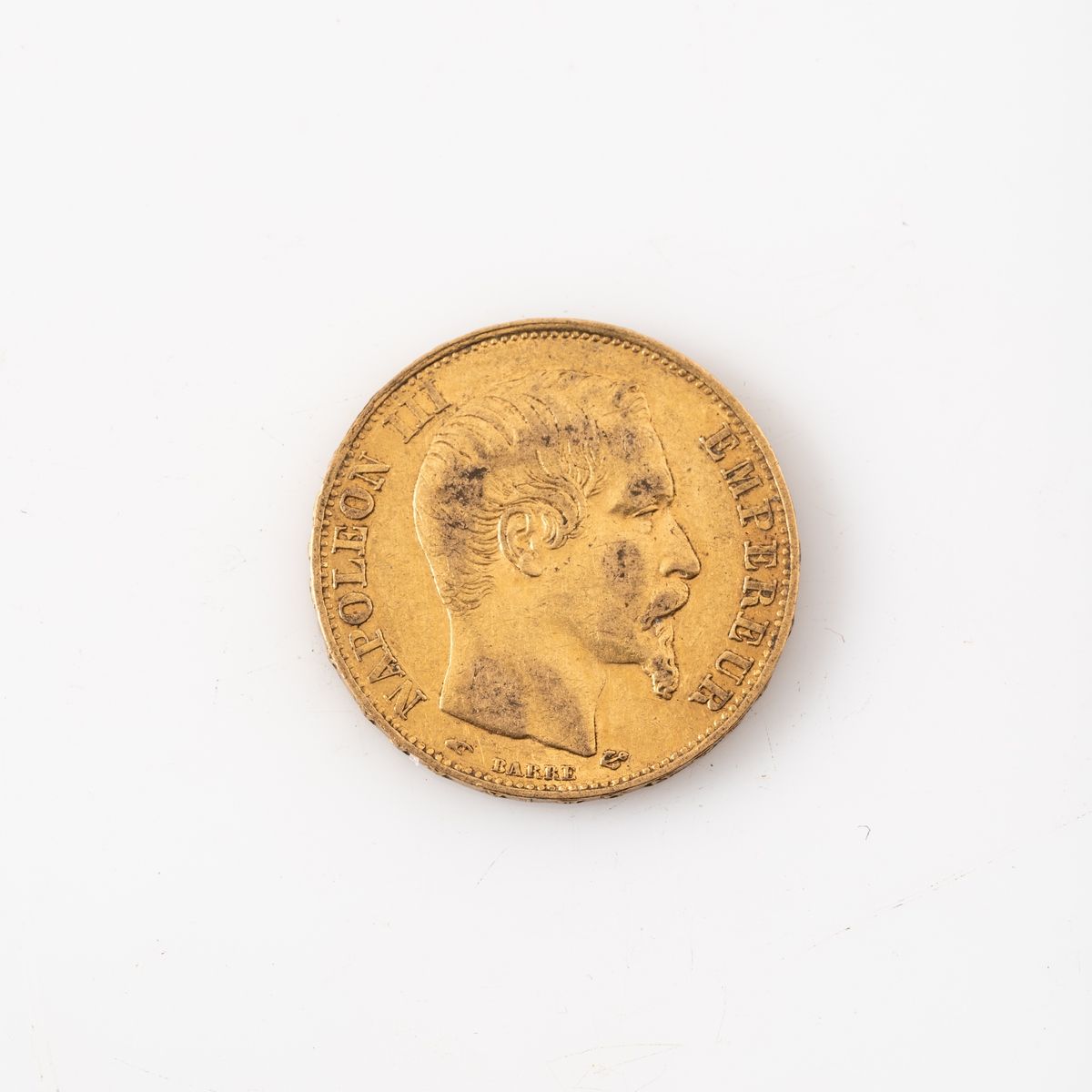 Null Une pièce en or de 20 Francs Napoléon III tête nue (1856 A). 

Poids : 6,45&hellip;