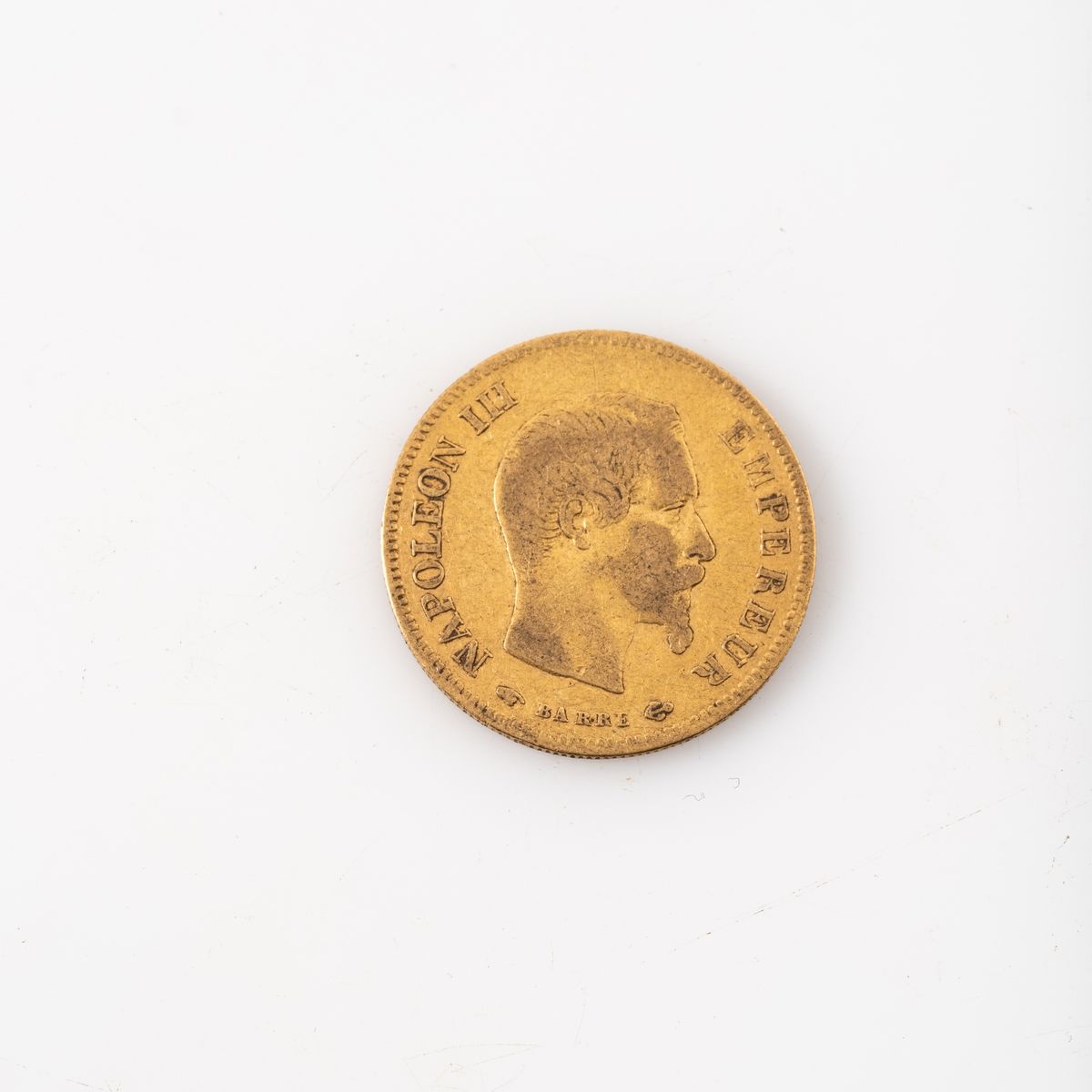 Null Une pièce en or de 10 Francs Napoélon III tête nue (1858 A). 

Poids : 3,22&hellip;