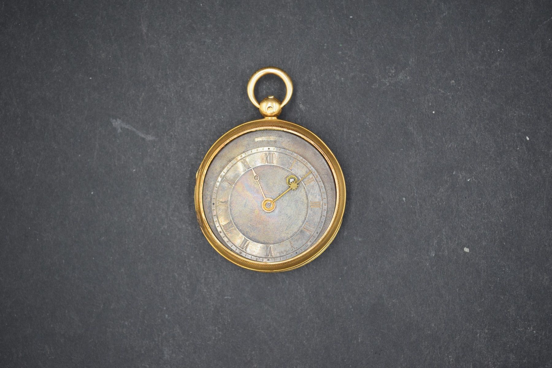 Null Débris de montre de gousset en or jaune 18k (750). 
Poids brut : 31 g.