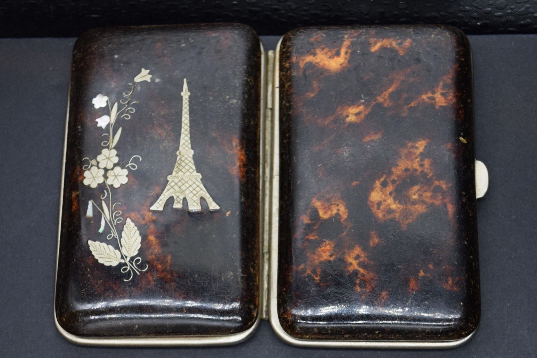 Null Bakelite cardholder with silver inlay featuring the Eiffel Tower and a spra&hellip;