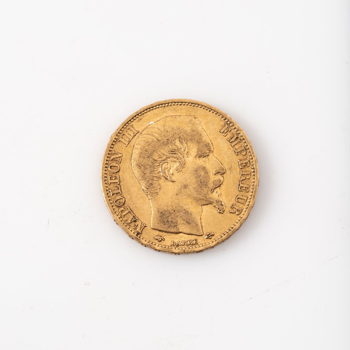 Null Une pièce en or de 20 Francs Napoléon III tête nue (1860 A). 

Poids : 6,45&hellip;