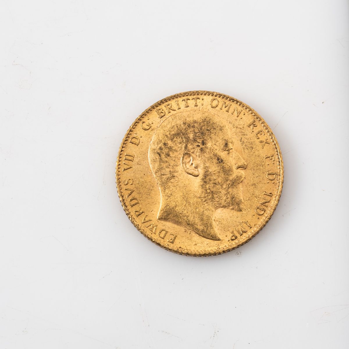 Null Une pièce en or d'1 Souverain Edouard VII (1906).

Poids : 7,98 g.