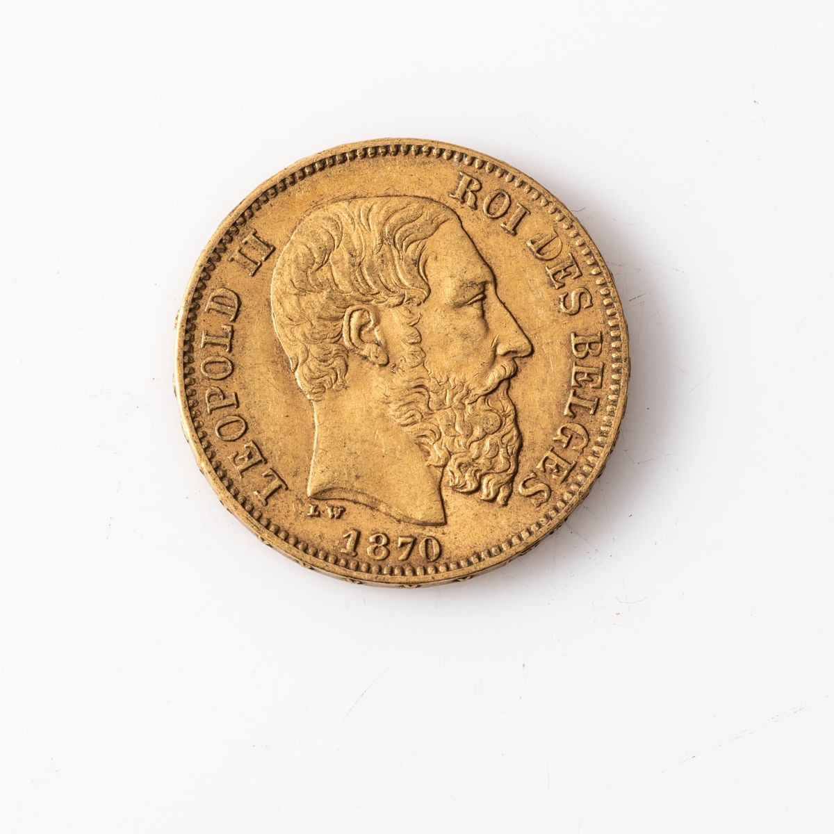 Null Une pièce en or de 20 Francs Belges Léopold II (1870).

Poids : 6,45 g.