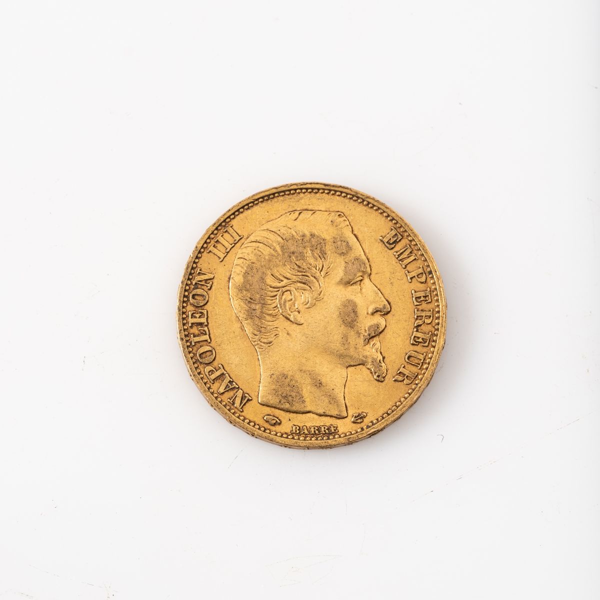 Null Une pièce en or de 20 Francs Napoléon III tête nue (1859 A).
 
Poids : 6,45&hellip;