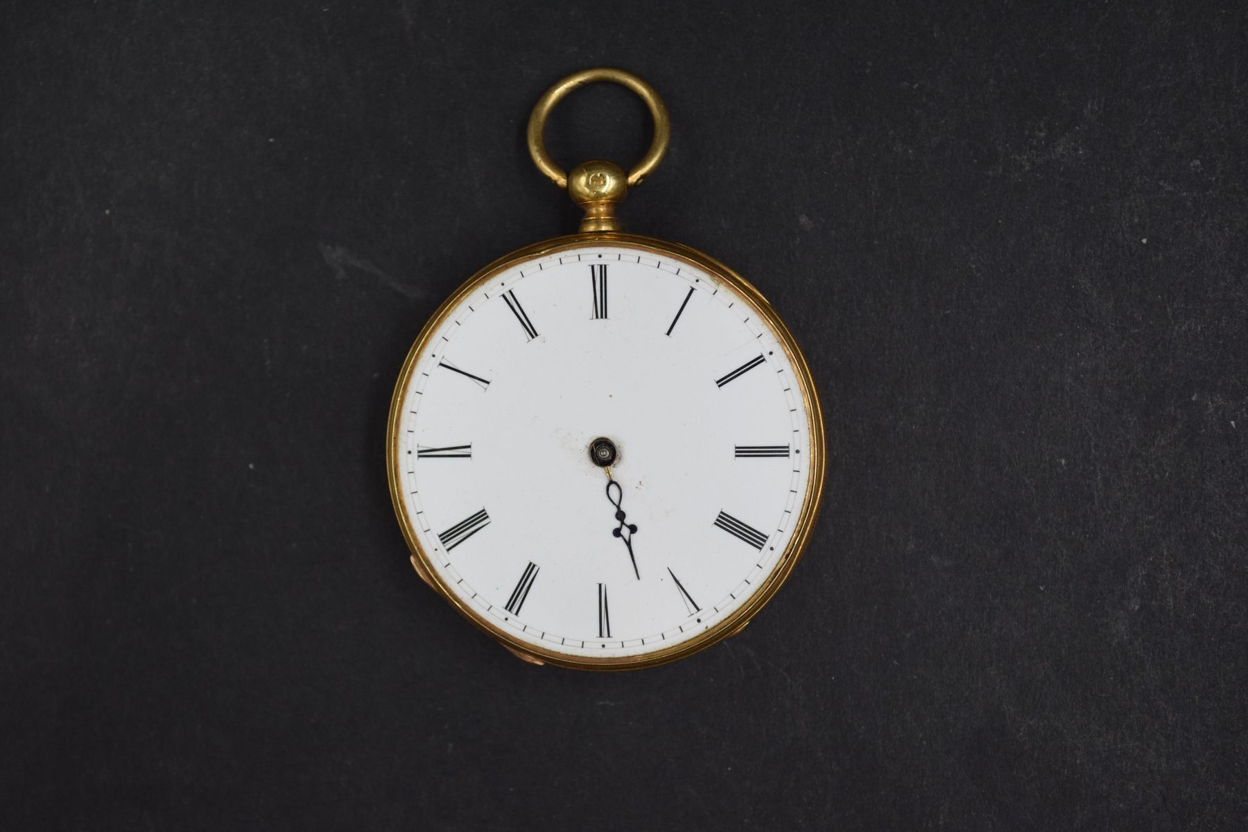 Null Débris de montre de gousset en or jaune 18k (750). 
Poids brut : 58.1 g.
