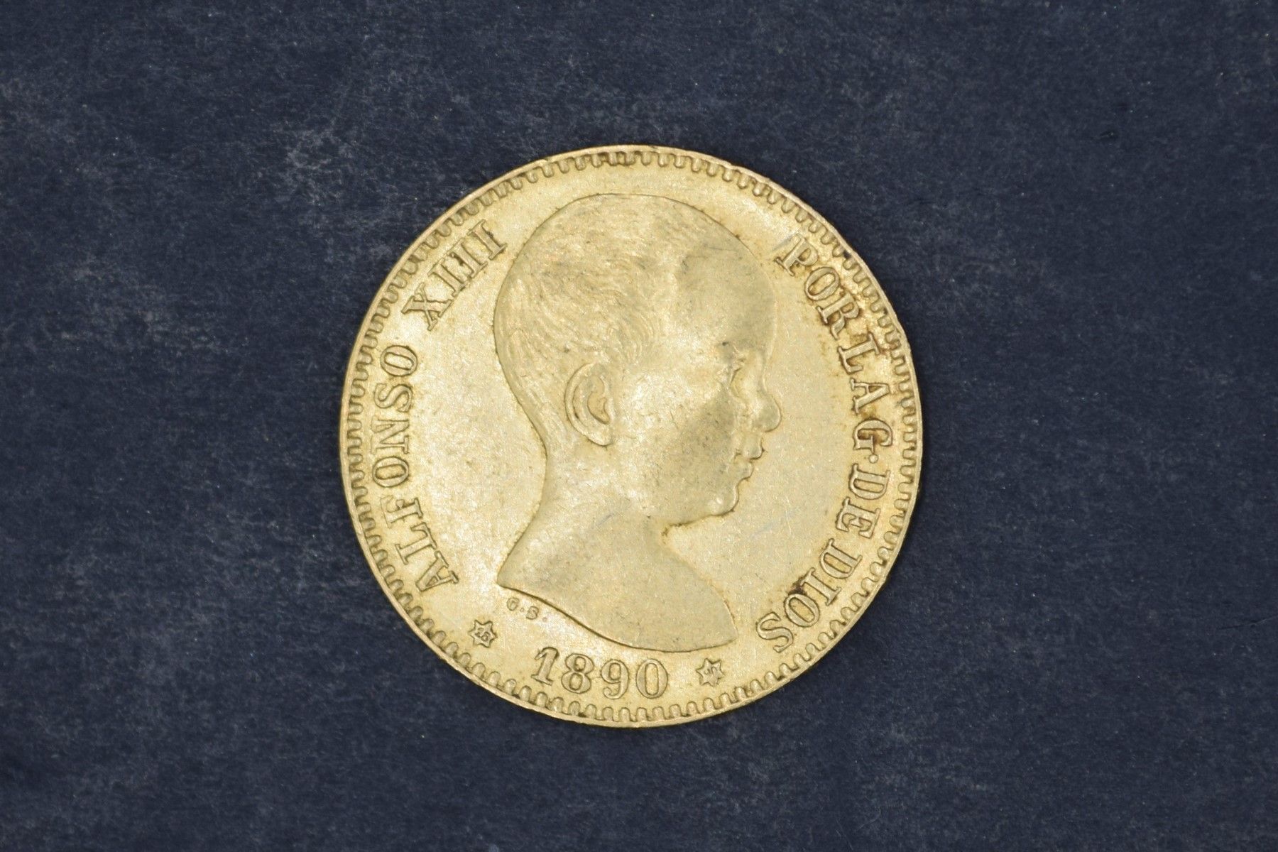 Null Une pièce en or de 20 Pesetas Alphonse XIII (1890).

Poids : 6,4 g.
