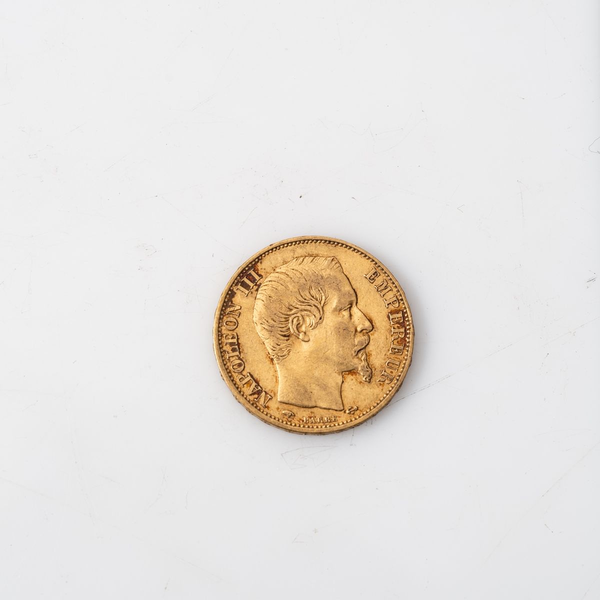 Null Une pièce en or de 20 Francs Napoléon III tête nue (1859, A).

Poids : 6,45&hellip;