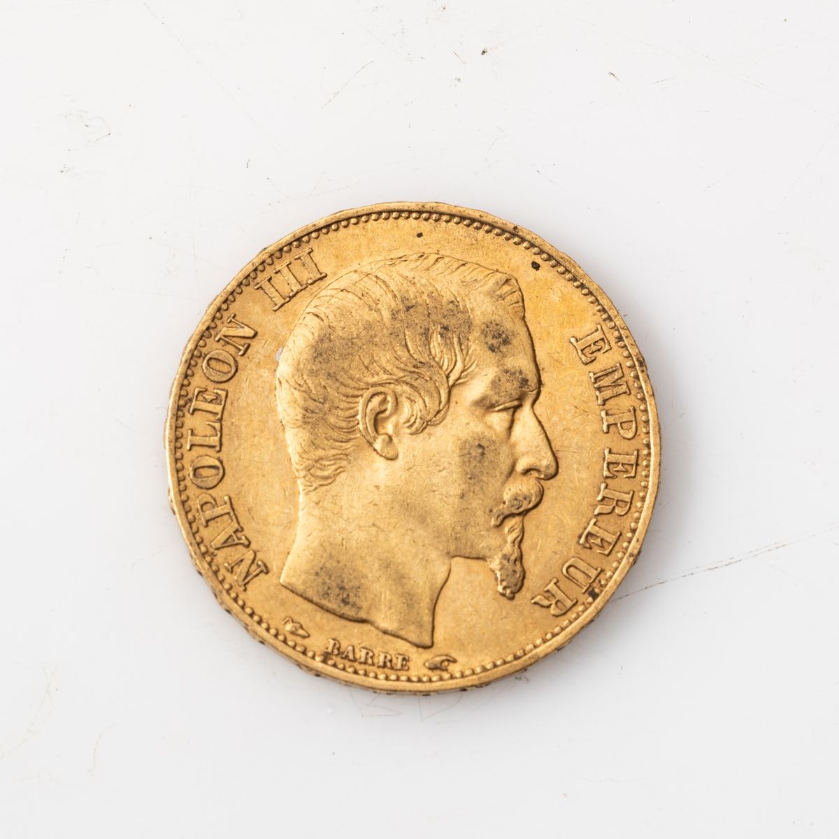 Null Une pièce en or de 20 Francs Napoléon III tête nue (1854, A).

Poids : 6,45&hellip;