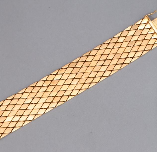 Null Bracelet articulé en or jaune 18k (750).

Poids : 63 g.