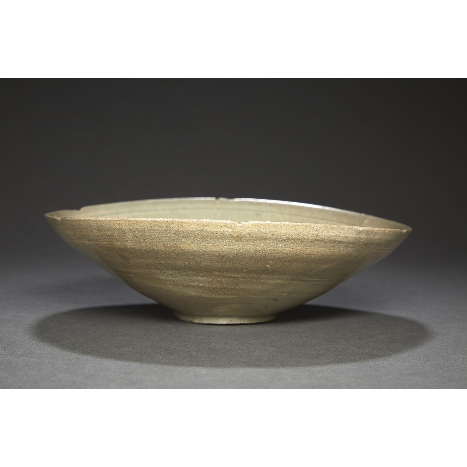Null POLYLOBED CUP
in celadon glazed stoneware on a crackled ground.
(Deformed).&hellip;