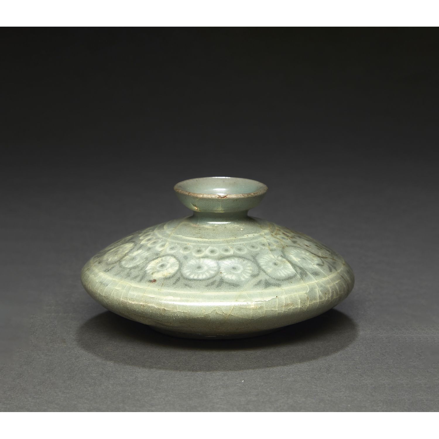 Null SMALL OIL BOTTLE
of flattened globular form with a small neck, in celadon e&hellip;