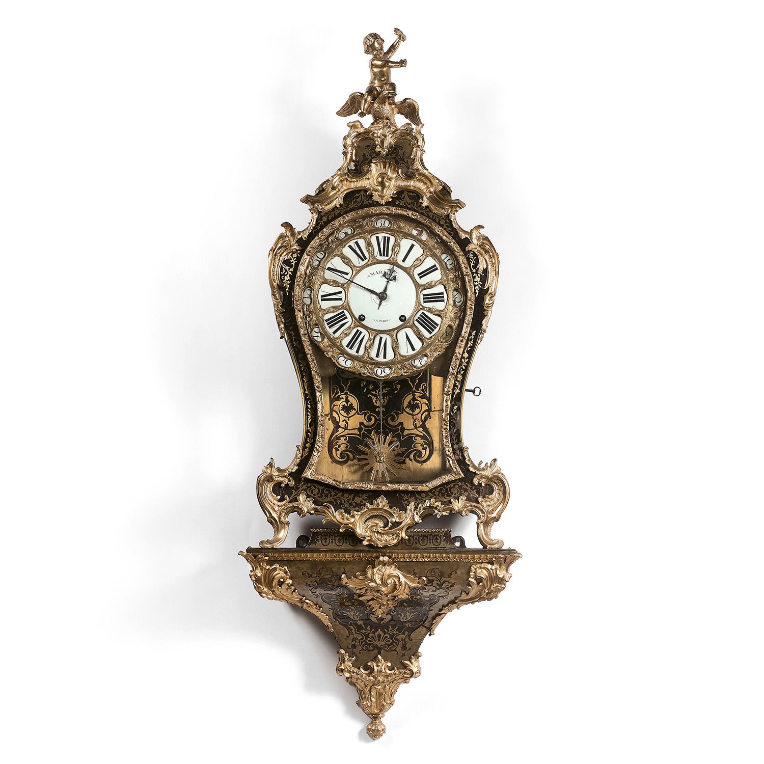 Null 一个卡特尔时钟和它的控制台，在 "boulle "镶嵌工艺中，由巴黎的MARTIN制作，盖有A.杜波依斯，有印记，路易十五时期
鎏金青铜制成，并以棕色&hellip;