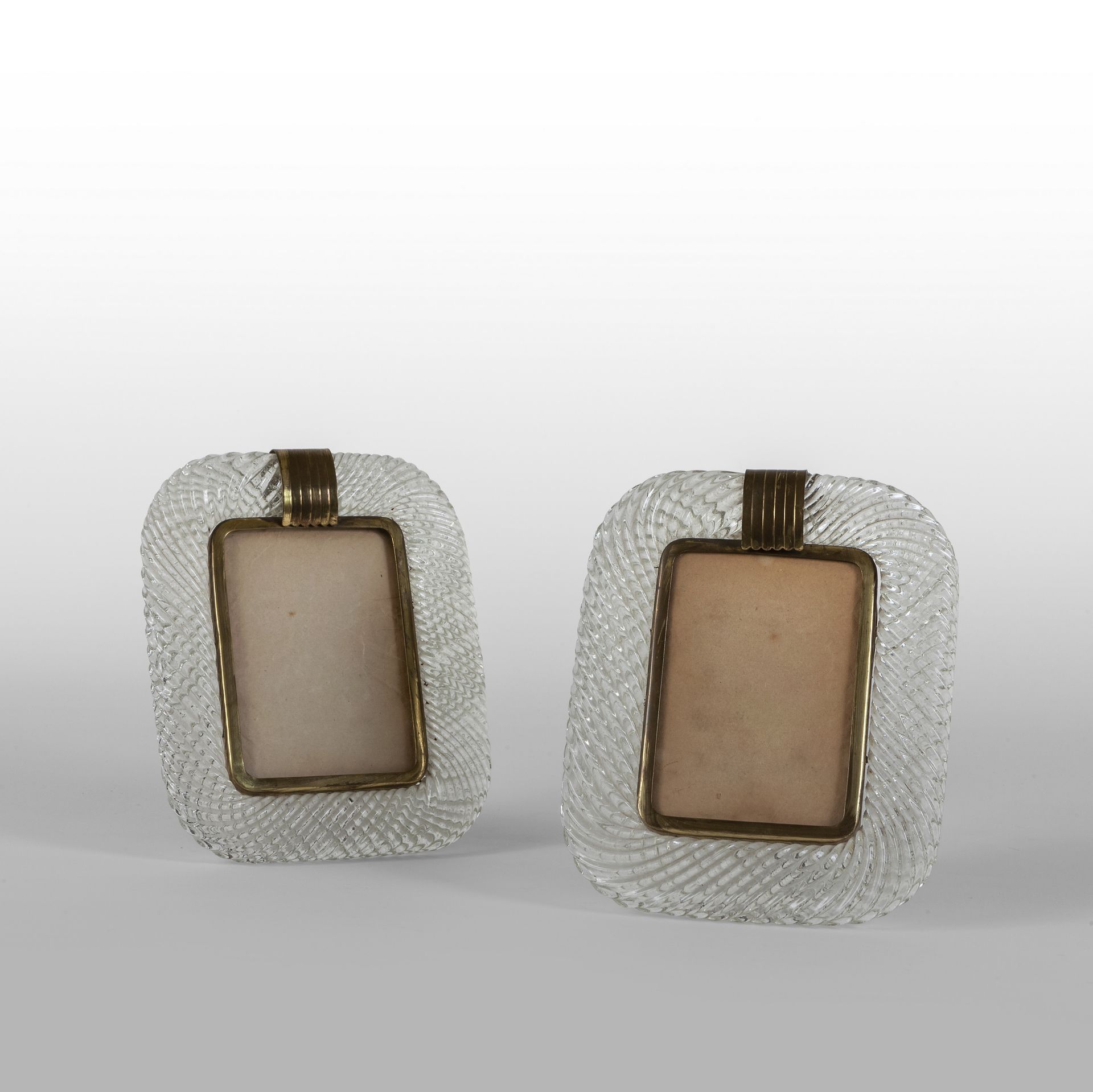 MURANO MURANO
Un par de portarretratos en cristal retorcido y latón años 30
Cm. &hellip;