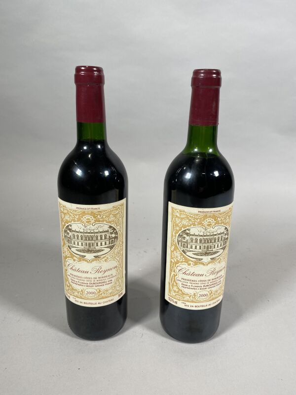Null 2 bottiglie Ch. Reynon Premières Côtes de Bordeaux 2000 (una a spalla alta,&hellip;