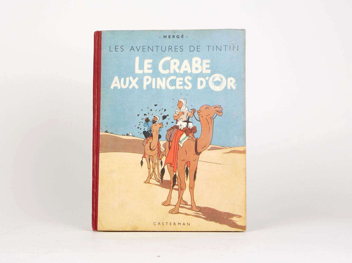 Null "Le Crabe aux pinces d'or" 1947. 
Dos rouge, 2ème plat B1. Titre en rouge e&hellip;