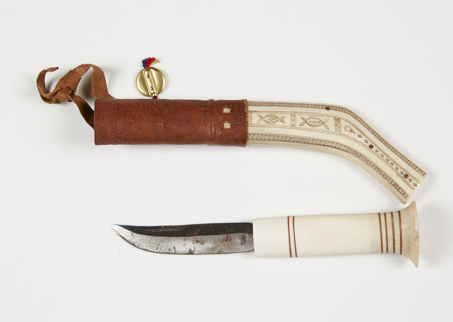 Null Finnish knife.
Bone handle and scabbard. 
B.E. Modern manufacture.
