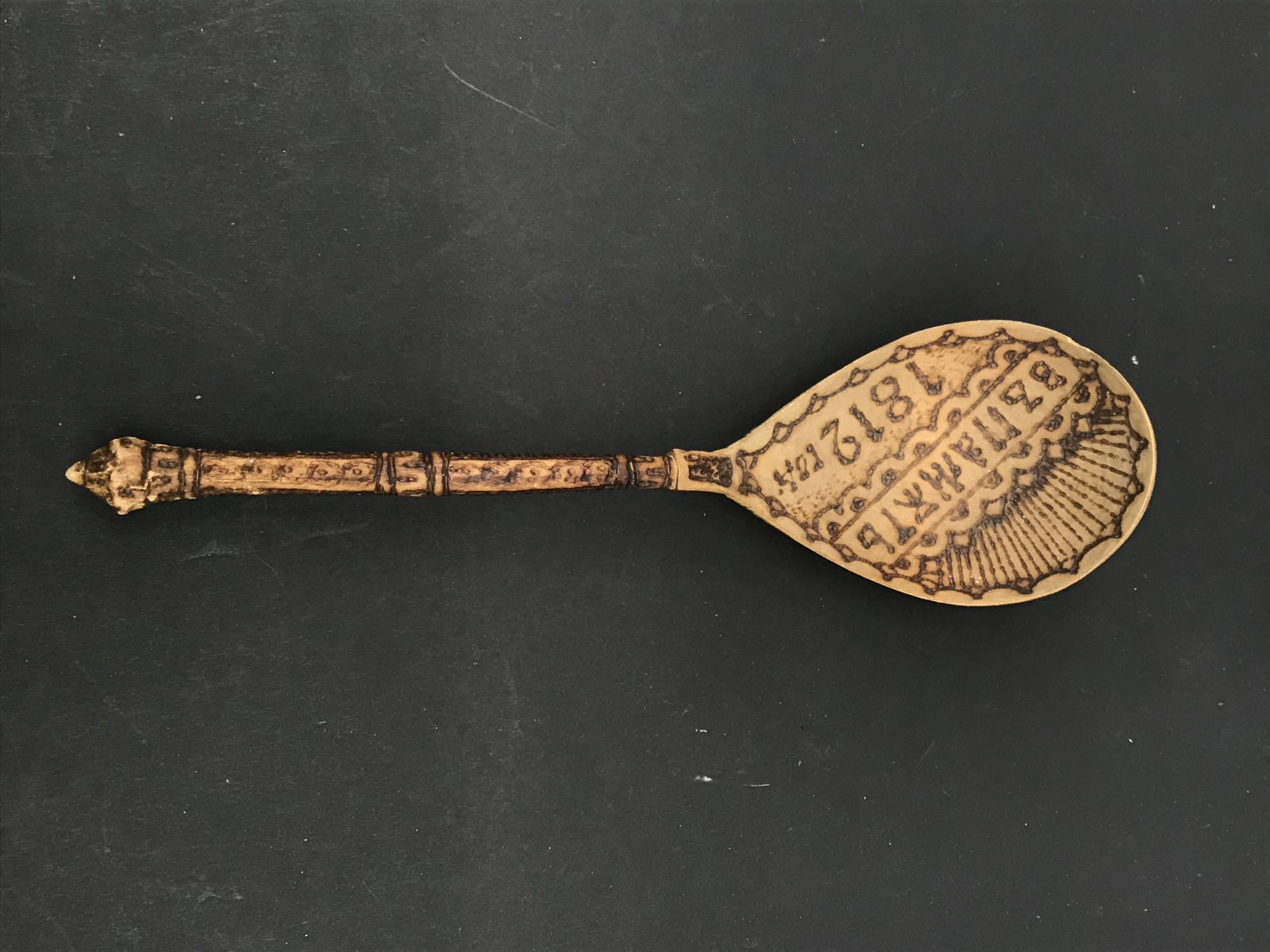 Null BORSCHT SPOON

Wooden spoon with pyrographed and painted decoration, featur&hellip;