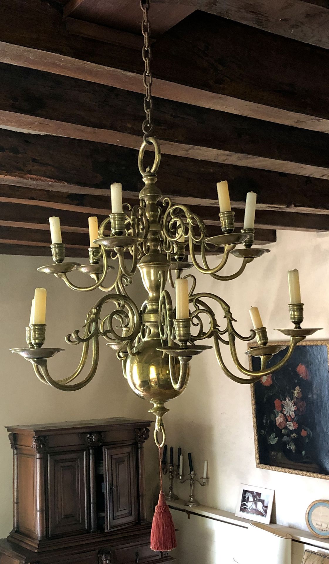Null A gilded brass chandelier with two rows of lights with six arms each. Balus&hellip;