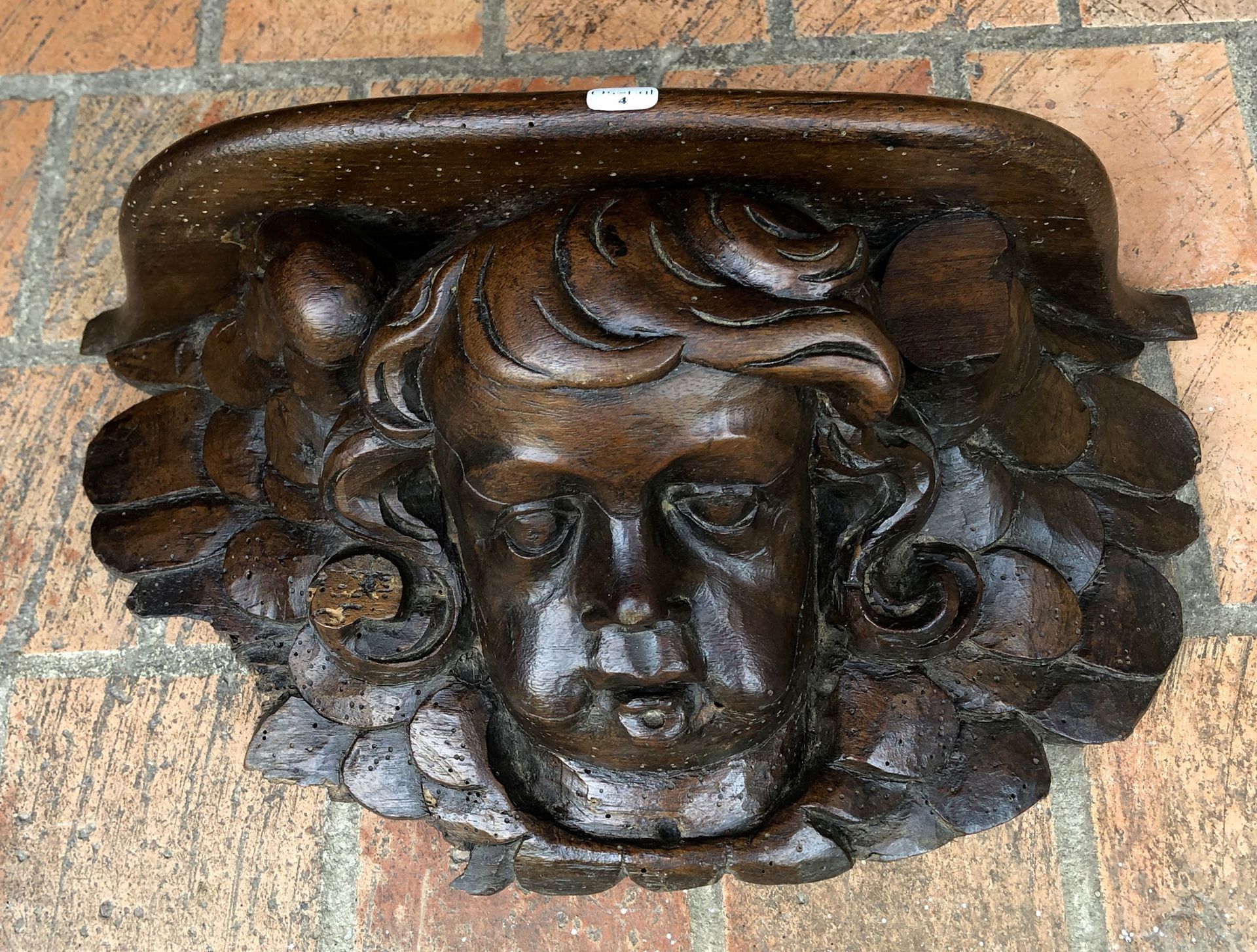 Null A low walnut light stand carved with a cherub's head, partly from the XVIIt&hellip;