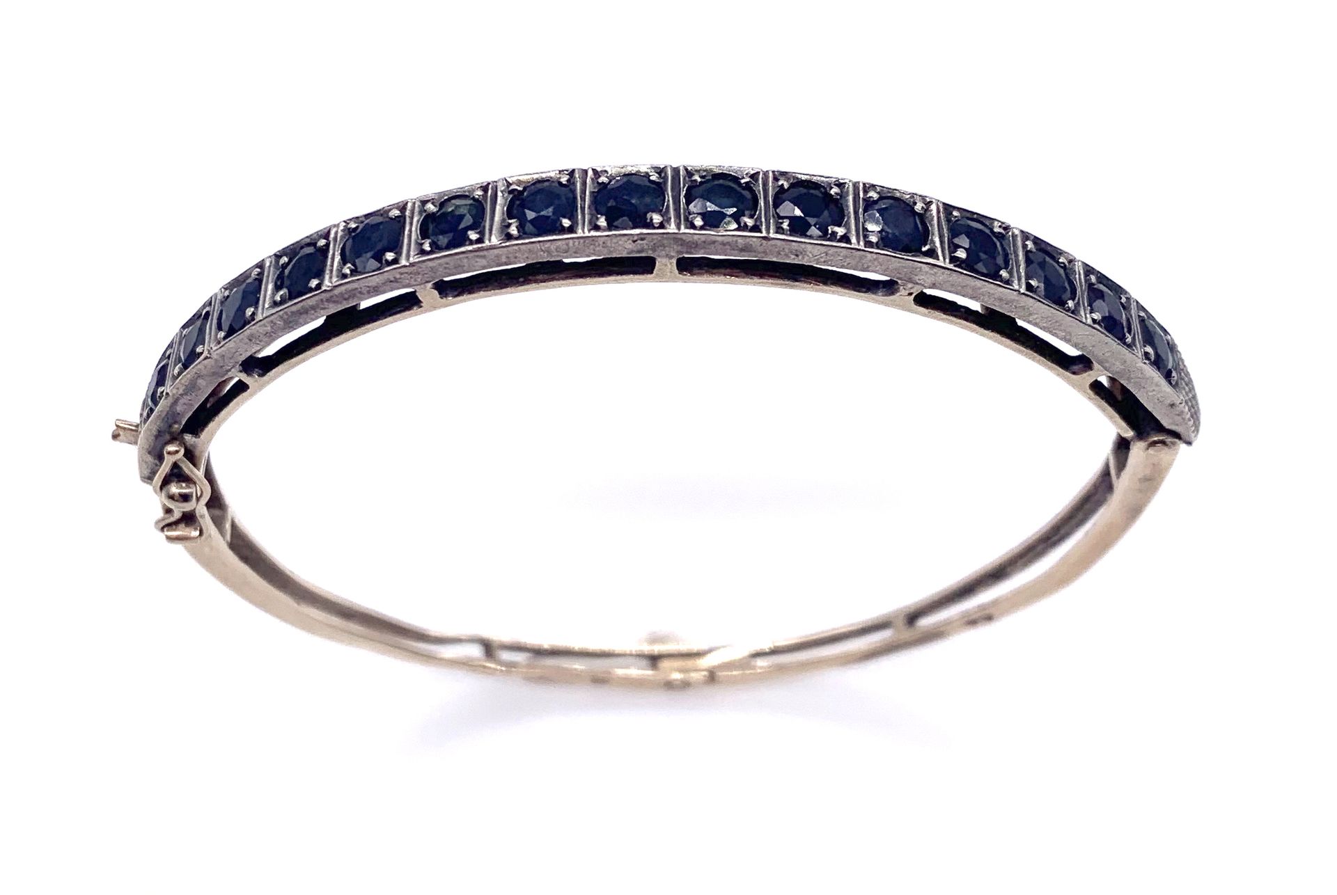 Null BRACELET decorated with a line of sapphires. 14K yellow gold and silver set&hellip;