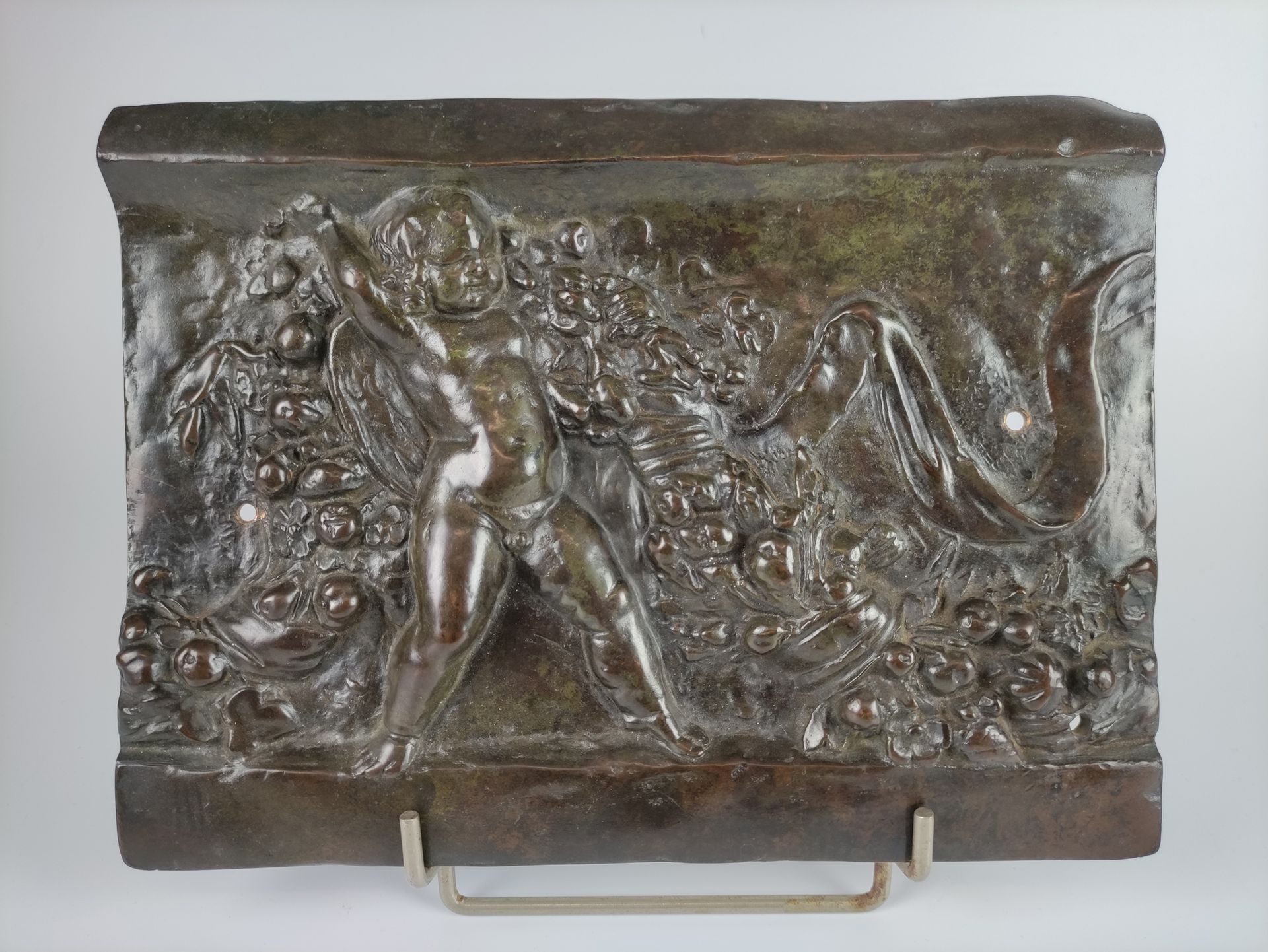 Null A bronze bas-relief with a brown patina representing a flock of putti. Fram&hellip;