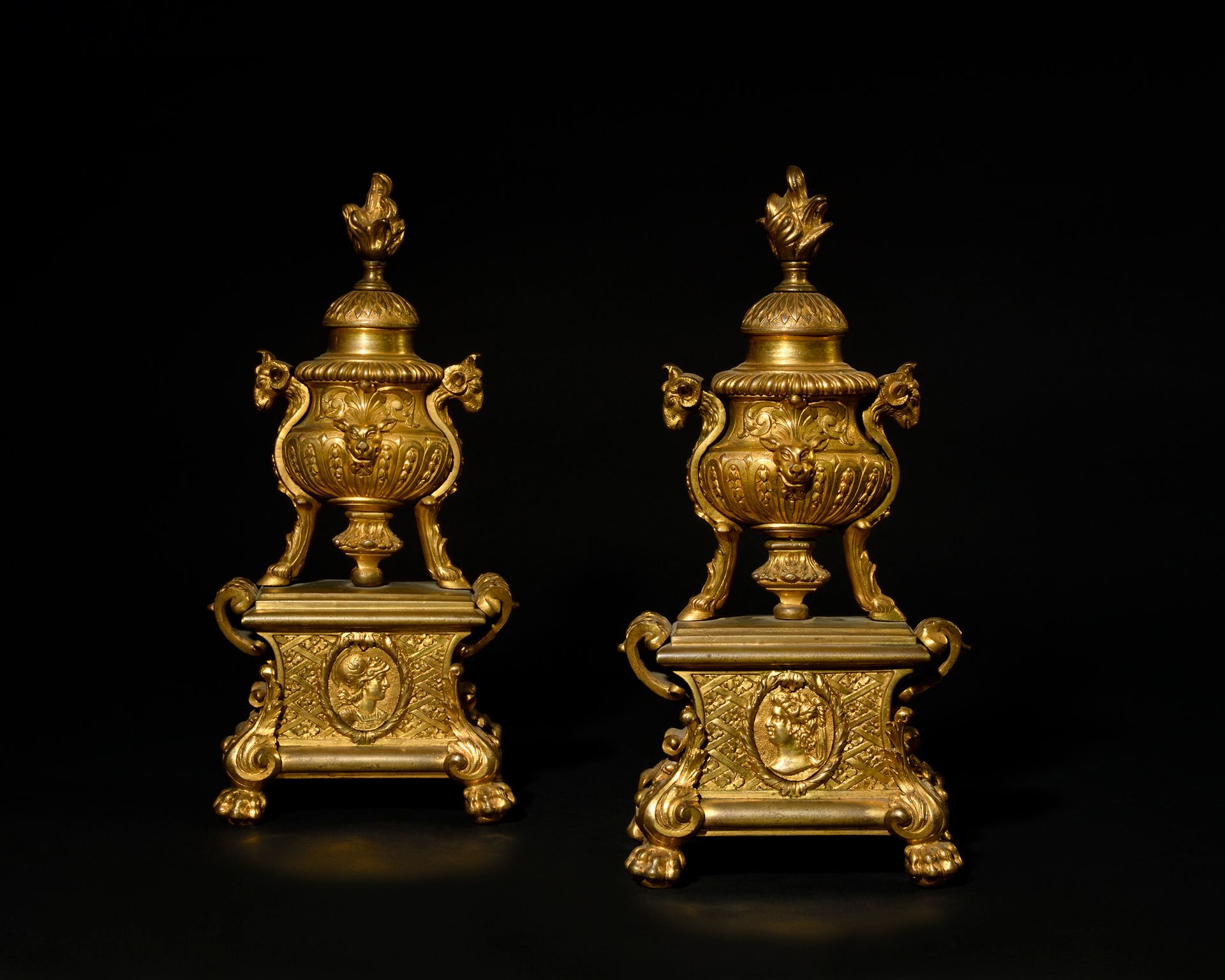 Null A PAIR OF SMALL ormolu CHENETS in the taste of André-Charles Boulle, with c&hellip;