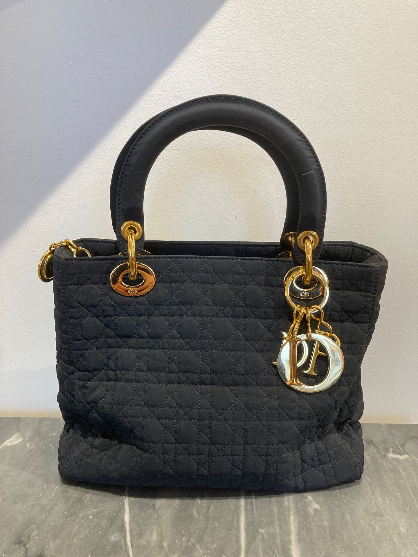Null DIOR Lady Dior bag in navy blue satin fabric with cane stitching, gold buck&hellip;
