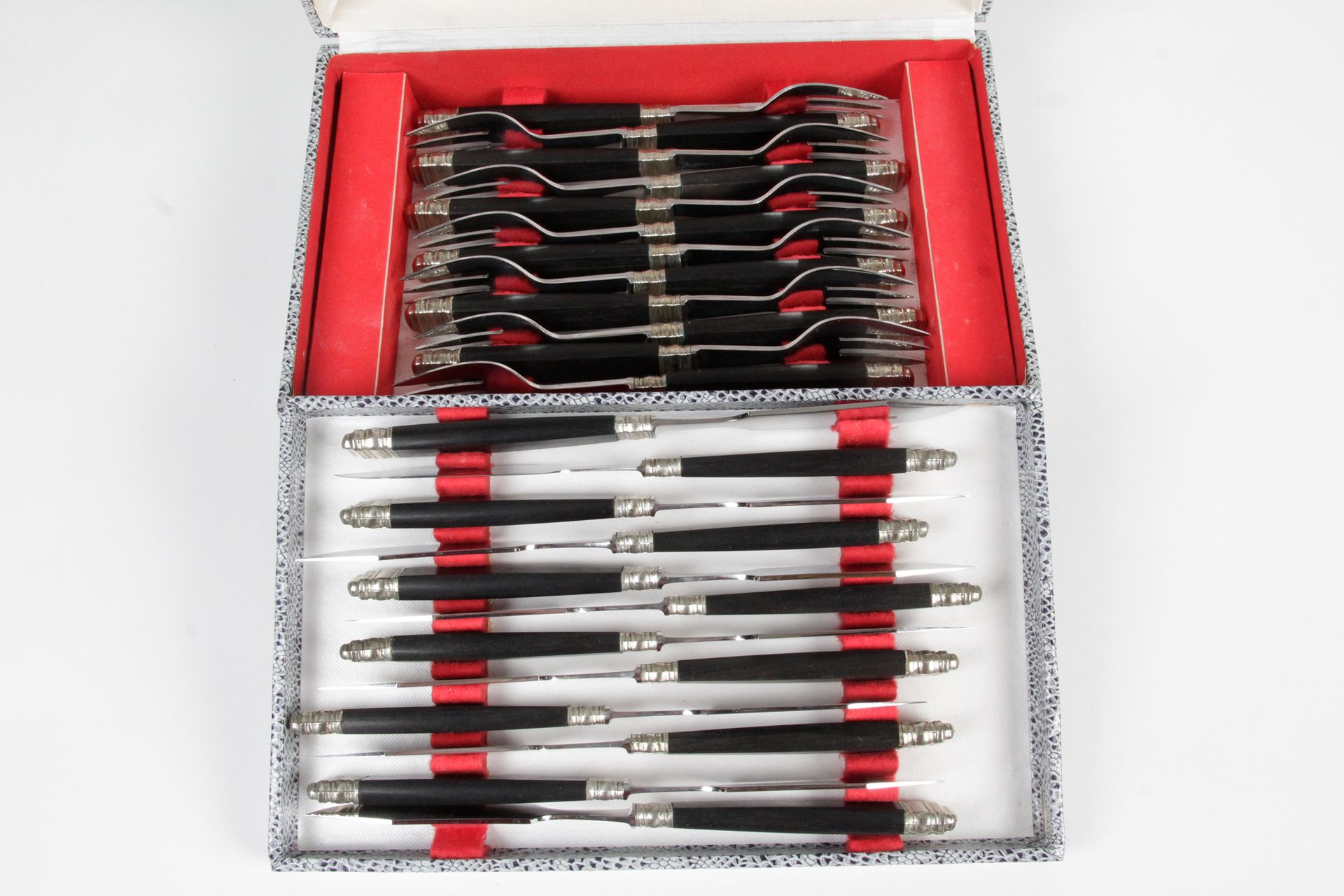 Null TWELVE FISH CUTLERY, stainless steel and ebony handle. In a box.