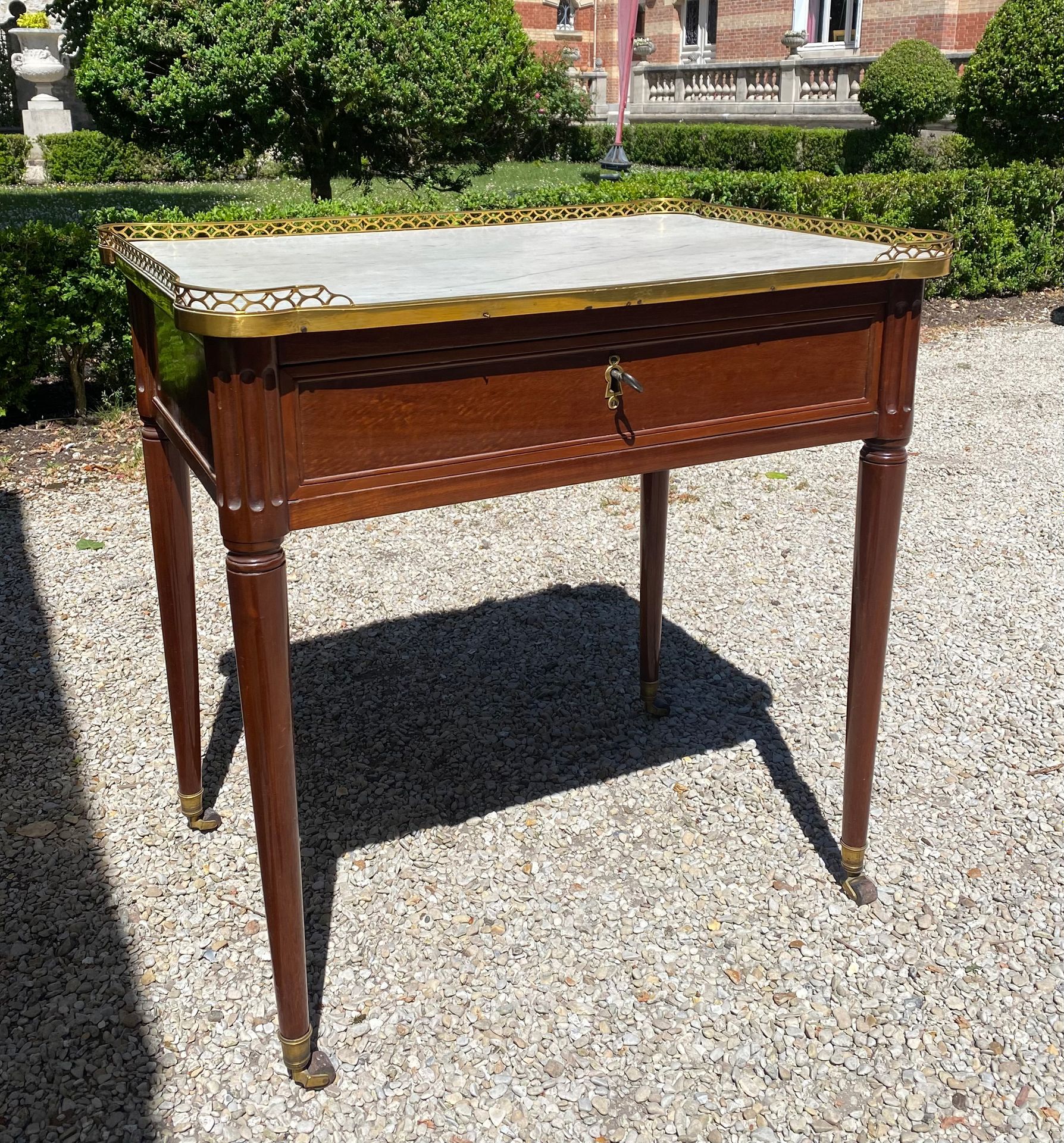 Null WRITING TABLE in mahogany opening with a drawer in the waist and resting on&hellip;