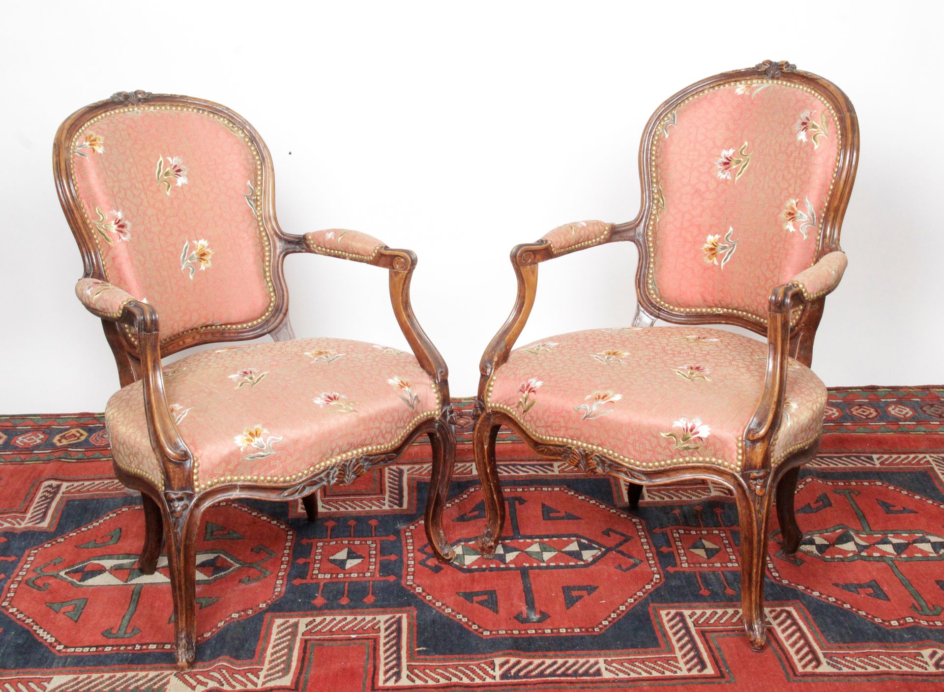 Null PAIR OF CABRIOLET CHAIRS in natural wood molded and carved with flowers, fo&hellip;