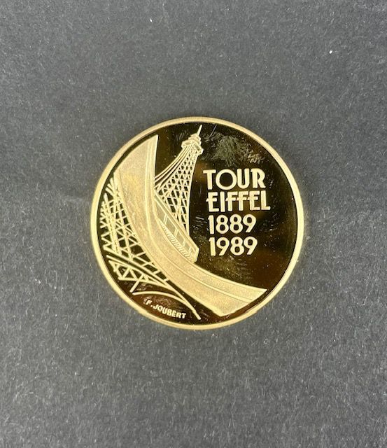 Null MONNAIE DE PARIS Commemorative coin 5 francs gold 920 Tour Eiffel. 1989. Ca&hellip;