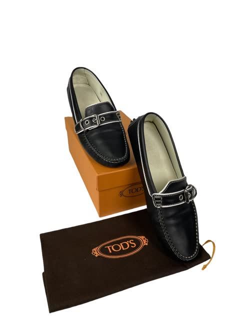 Null TODS Pair of black leather moccasins with white piping and buckle. Box and &hellip;