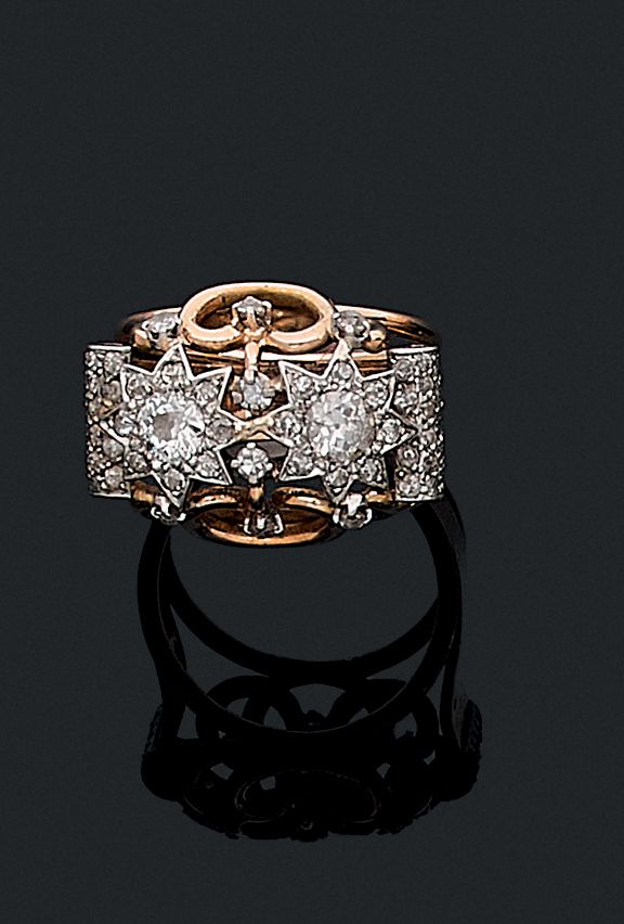 Null 1950'S

RING 

decorated with two stars and interlacing paved with old cut &hellip;
