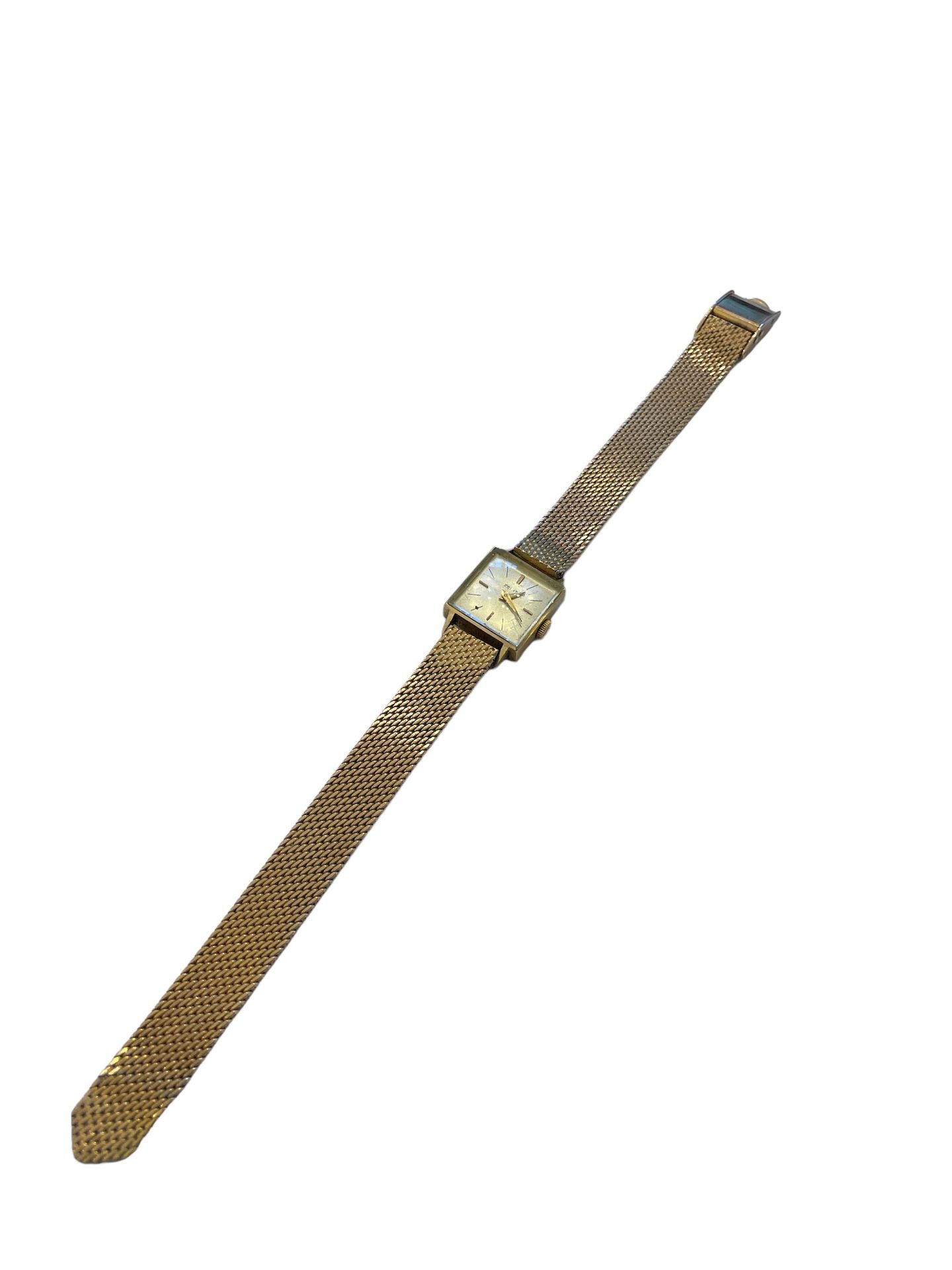 Null ZENITH
Golduhr mit quadratischem Gehäuse, Armband aus vergoldetem Metall.
B&hellip;