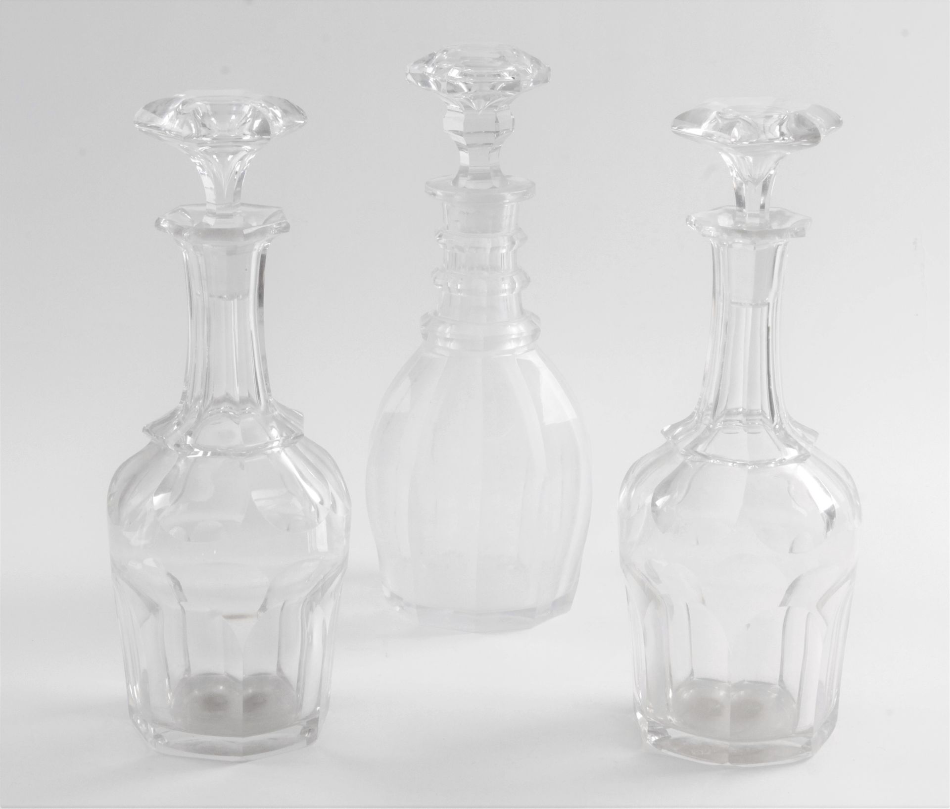 Null THREE CARAFES and their stoppers in faceted crystal. 

Period : XIXth centu&hellip;