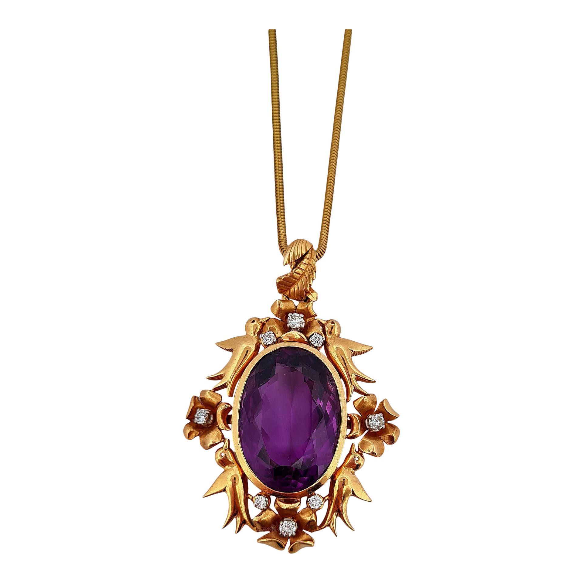 Null PENDANT 
holding an oval amethyst of about 25 carats in a setting of birds &hellip;