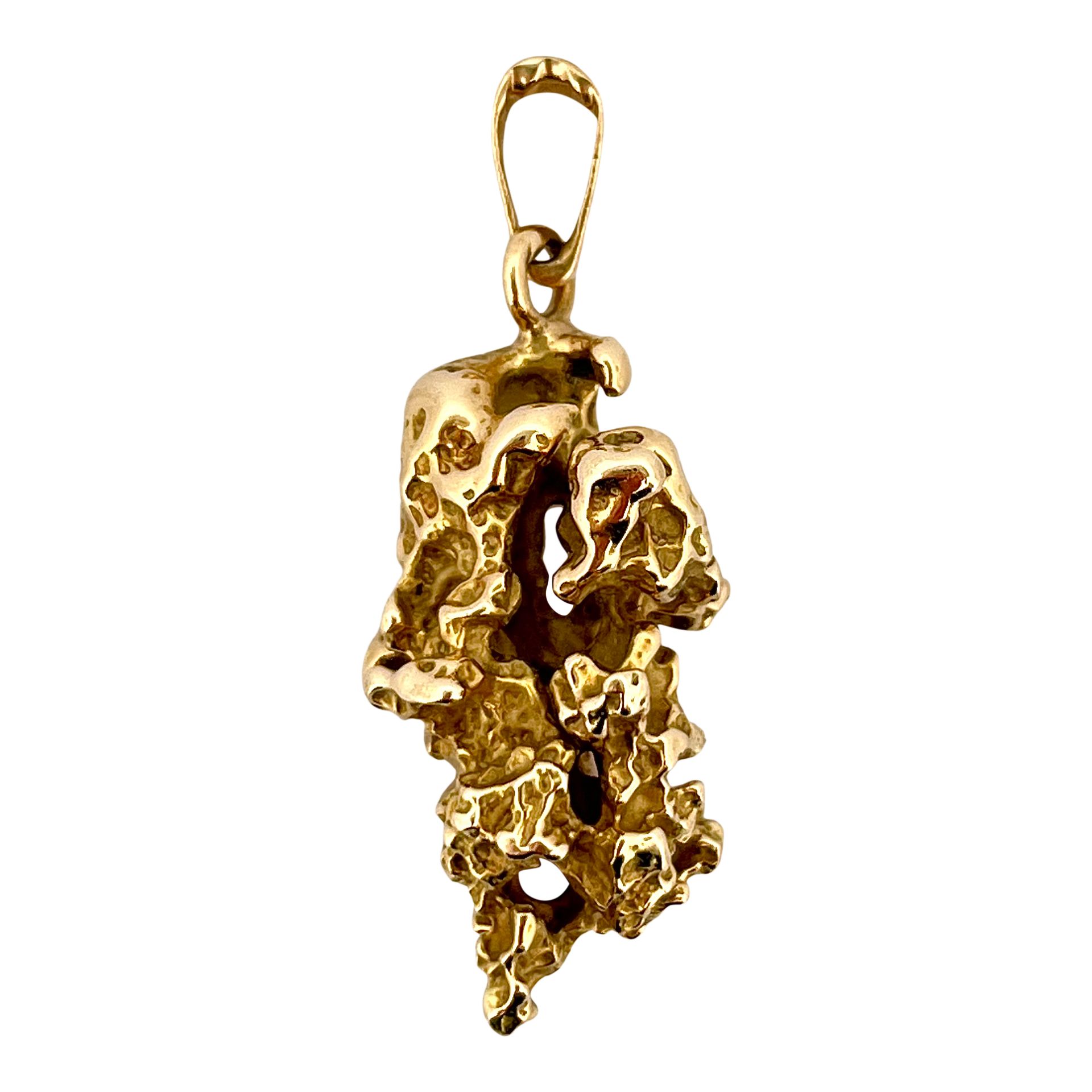 Null PENDANTS 
holding a nugget. Mounted in 14K yellow gold. 
Dimensions : 4.4 x&hellip;